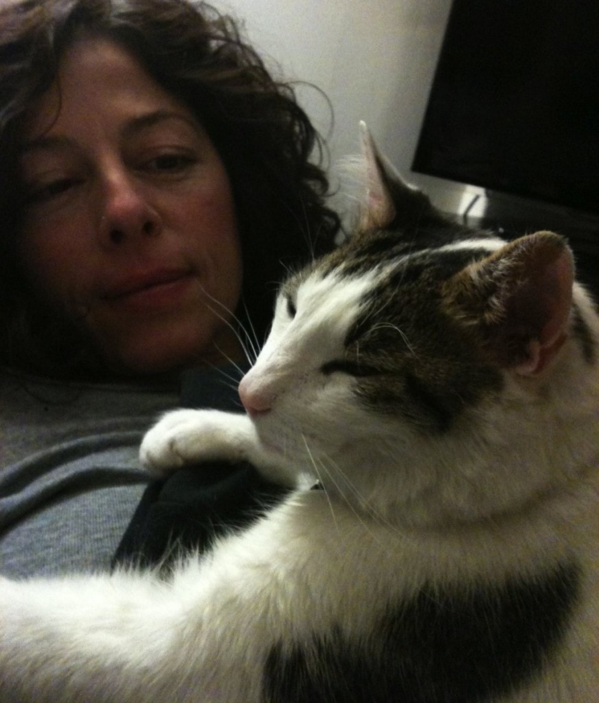 Jeanine Foucher, pictured here with her adopted pet, Nick, is among the many single women in Seattle who have a cat.